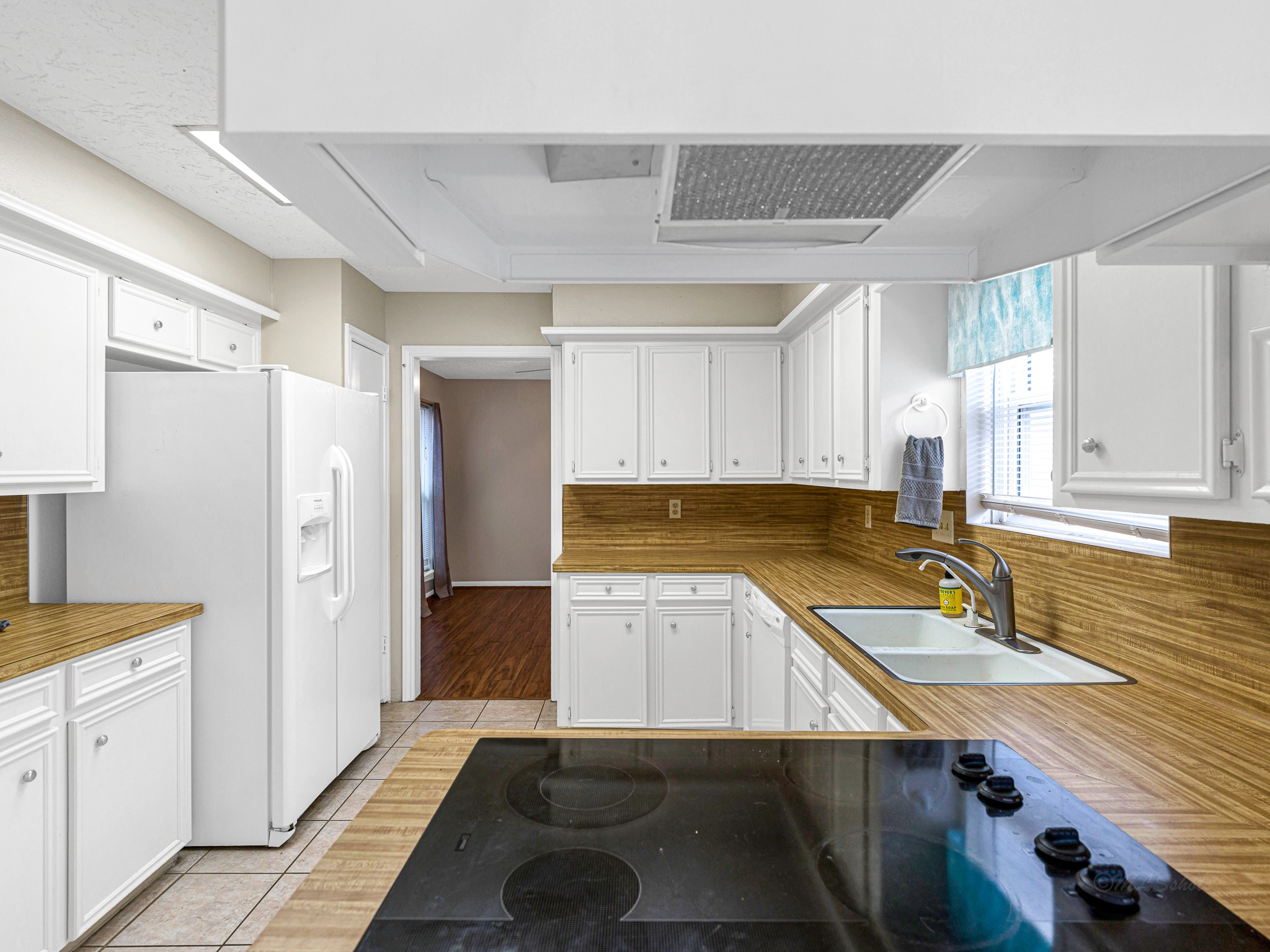 22906 Squirrel Tree Street Spring, TX 77389 - Photo 10 of 41 a kitchen with a sink appliances and cabinets
