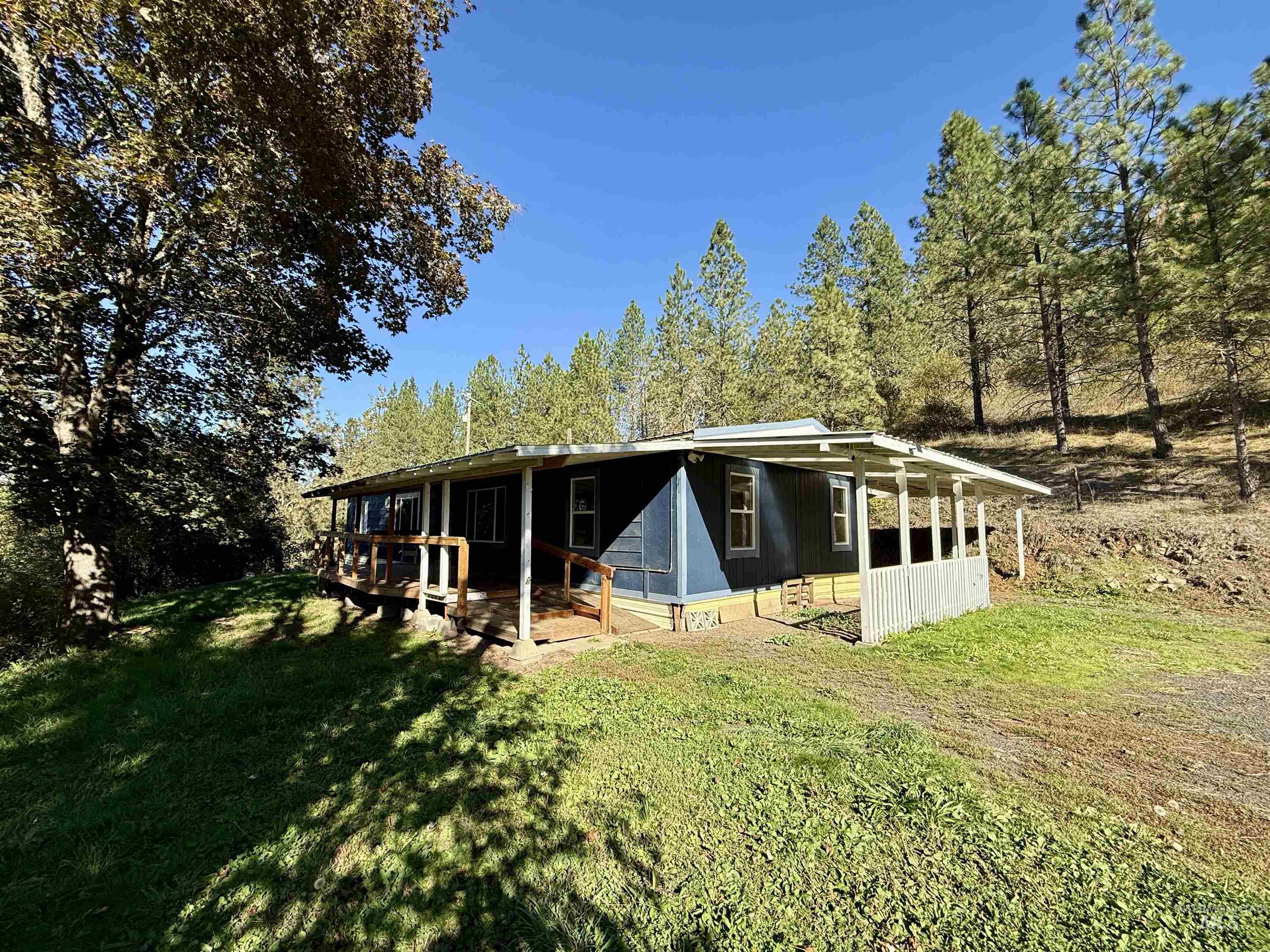 191 Battle Ridge Road Kooskia, ID 83539 - Photo 35 of 35 Back of house featuring a yard
