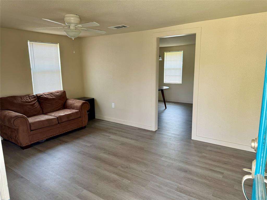 211 Sperry Lane Red Oak, TX 75154 - Photo 4 of 16 a living room with furniture and a wooden floor