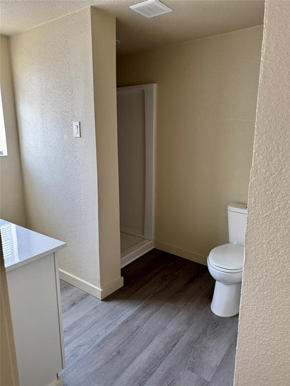 211 Sperry Lane Red Oak, TX 75154 - Photo 9 of 16 a bathroom with a toilet and a sink