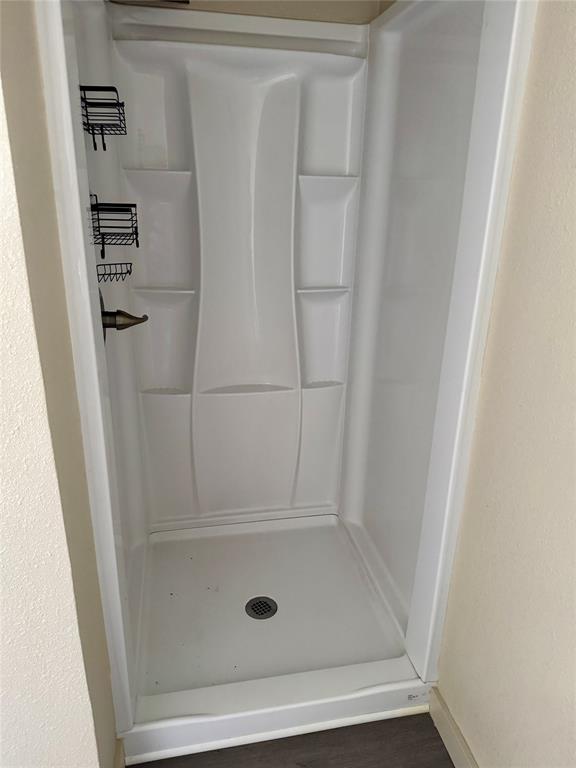 211 Sperry Lane Red Oak, TX 75154 - Photo 10 of 16 a bathroom with a glass shower door