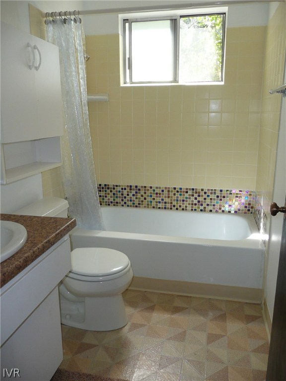 609 Village Boulevard Incline Village, NV 89451 - Photo 11 of 21 a bathroom with a granite countertop toilet a sink and bathtub