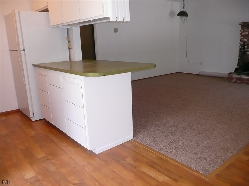 609 Village Boulevard Incline Village, NV 89451 - Photo 12 of 21 a kitchen with a sink cabinets and wooden floor