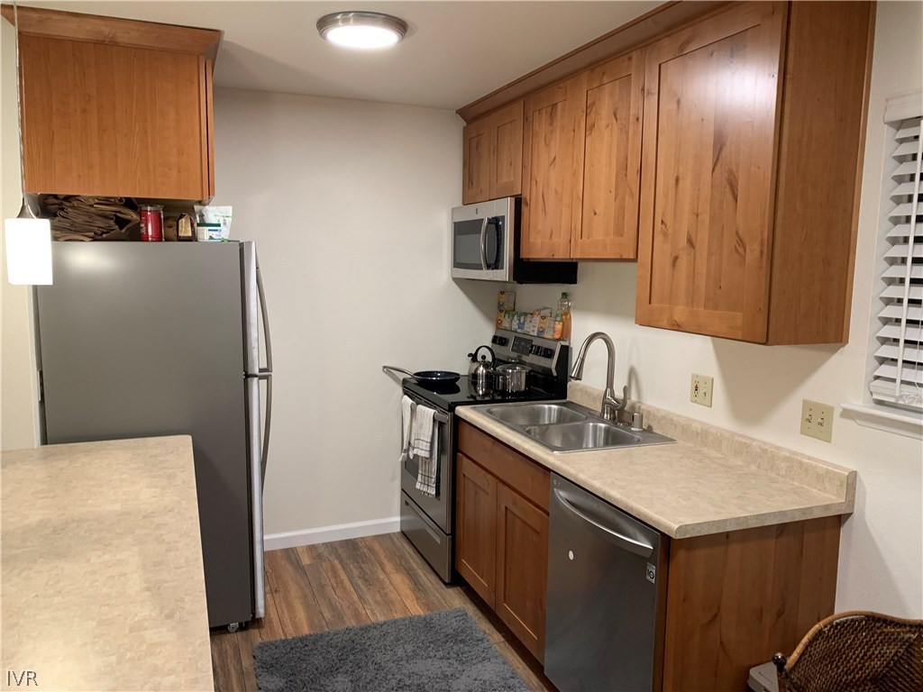 609 Village Boulevard Incline Village, NV 89451 - Photo 20 of 21 a kitchen with a sink a stove and a refrigerator