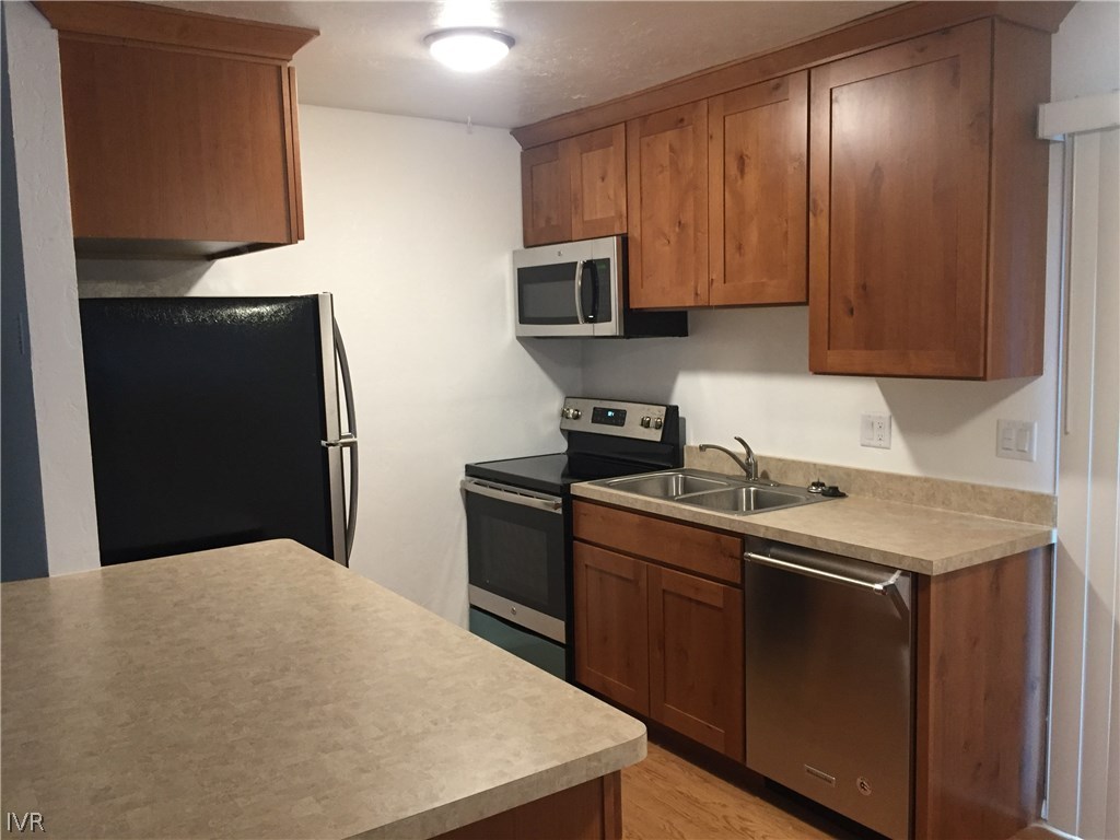 609 Village Boulevard Incline Village, NV 89451 - Photo 8 of 21 a kitchen with a sink a stove and cabinets