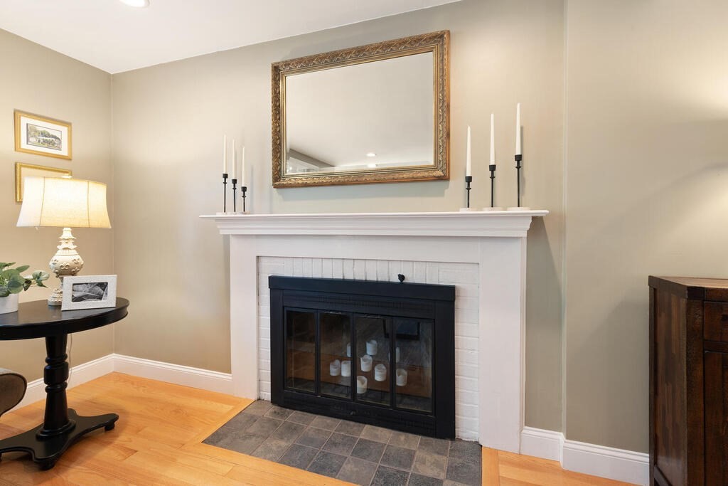32 Stonebrook Road Sudbury, MA 01776 - Photo 8 of 35 a living room with furniture and a fireplace