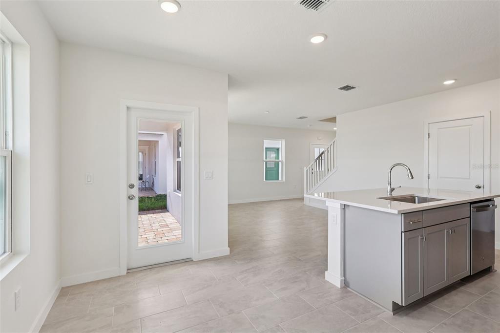 6493 Horseshoe Ln Way St. Cloud, FL 34773 - Photo 11 of 29 a view of a kitchen with a sink and a window