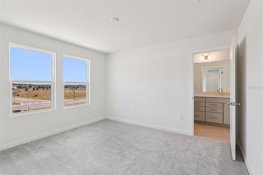 6493 Horseshoe Ln Way St. Cloud, FL 34773 - Photo 14 of 29 an empty room with windows and closet