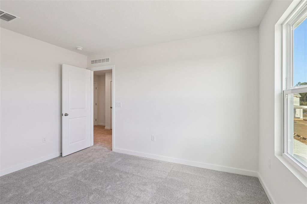 6493 Horseshoe Ln Way St. Cloud, FL 34773 - Photo 15 of 29 an empty room with windows and closet