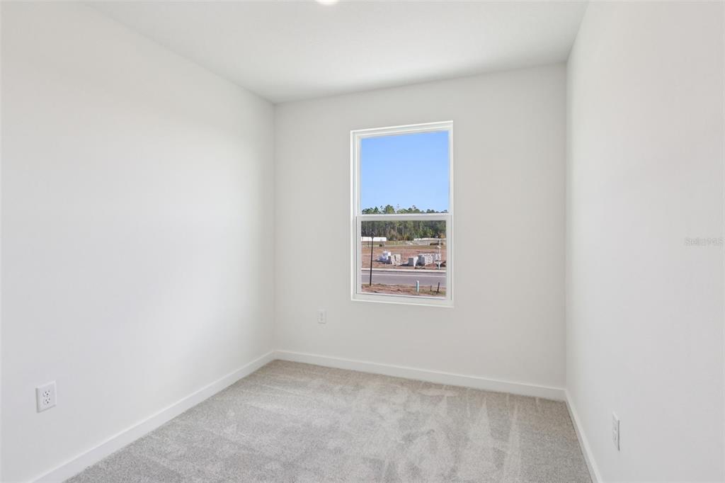 6493 Horseshoe Ln Way St. Cloud, FL 34773 - Photo 19 of 29 an empty room with a window