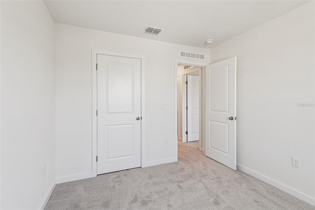 6493 Horseshoe Ln Way St. Cloud, FL 34773 - Photo 23 of 29 a view of an empty room