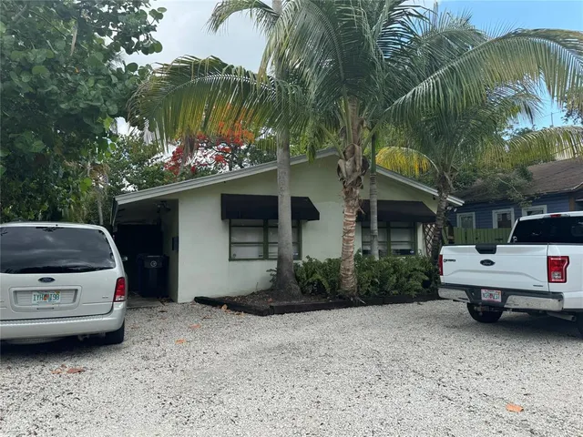 a view of a car in front of a house