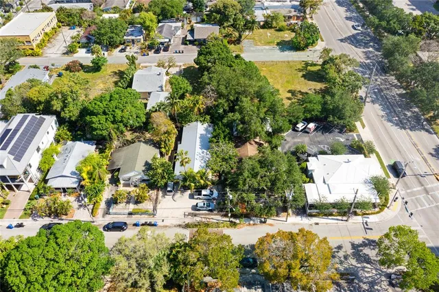 an aerial view of residential houses with outdoor space