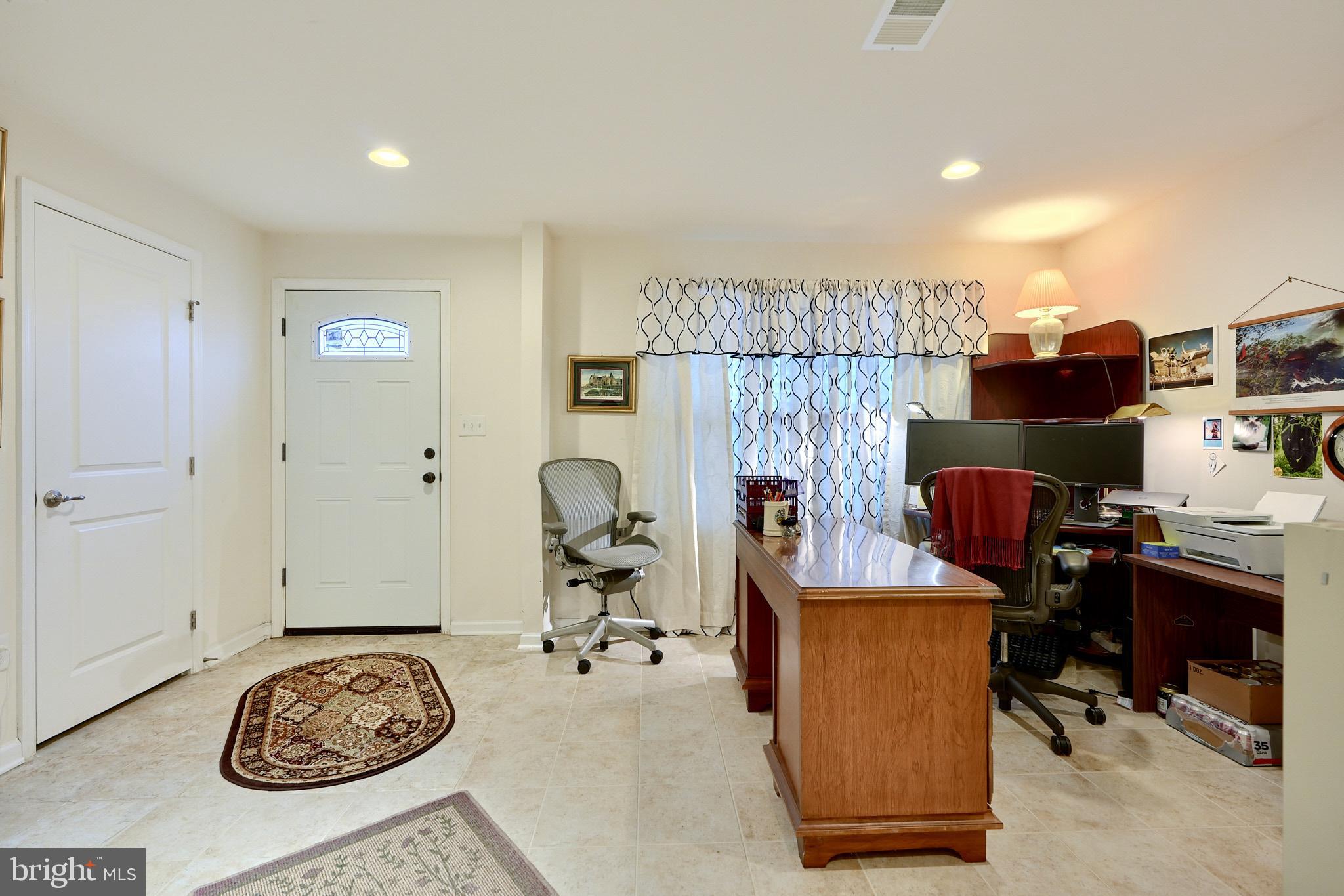 814 Oldham Street Baltimore, MD 21224 - Photo 6 of 45 a view of a workspace with furniture and a gate