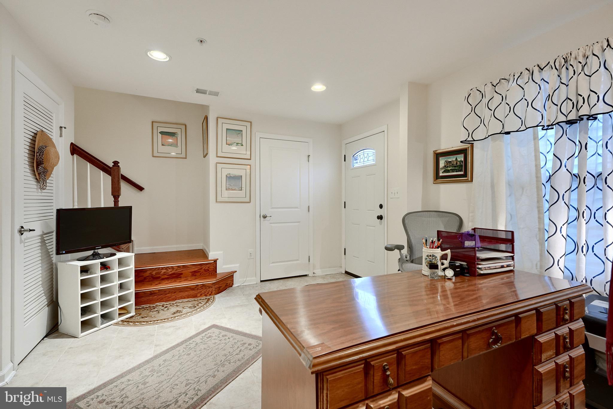 814 Oldham Street Baltimore, MD 21224 - Photo 7 of 45 a living room with furniture and a flat screen tv
