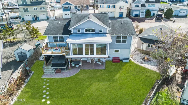 a view of a hallway with wooden floor and closet