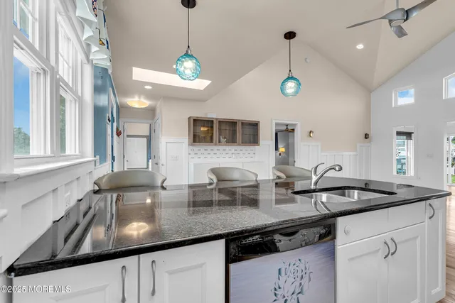 an aerial view of a house with outdoor space and lake view