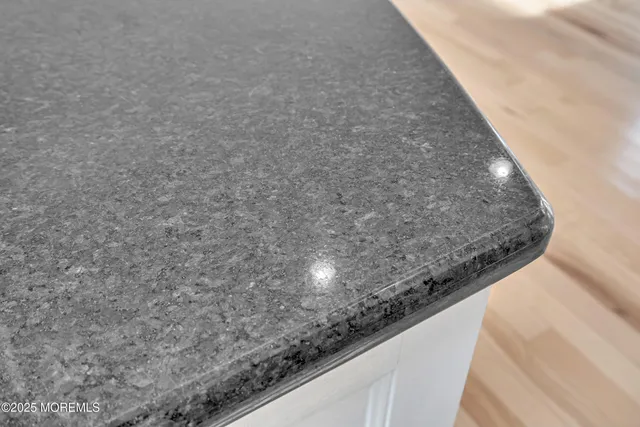 an aerial view of a house with outdoor space and lake view