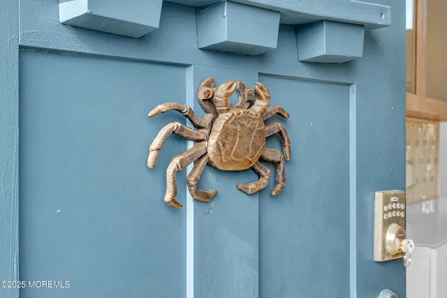 a living room with stainless steel appliances kitchen island granite countertop a stove and a refrigerator