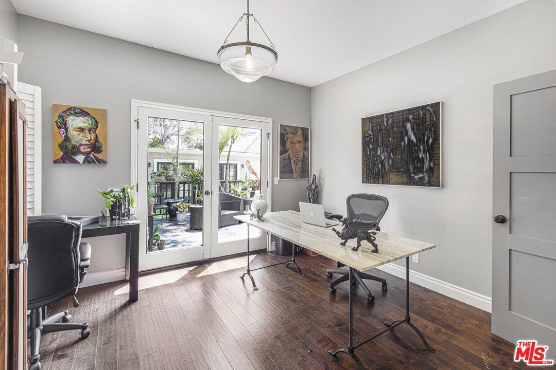 1908 Buckingham Road Los Angeles, CA 90016 - Photo 11 of 39 a living room with furniture a dining table and a wooden floor