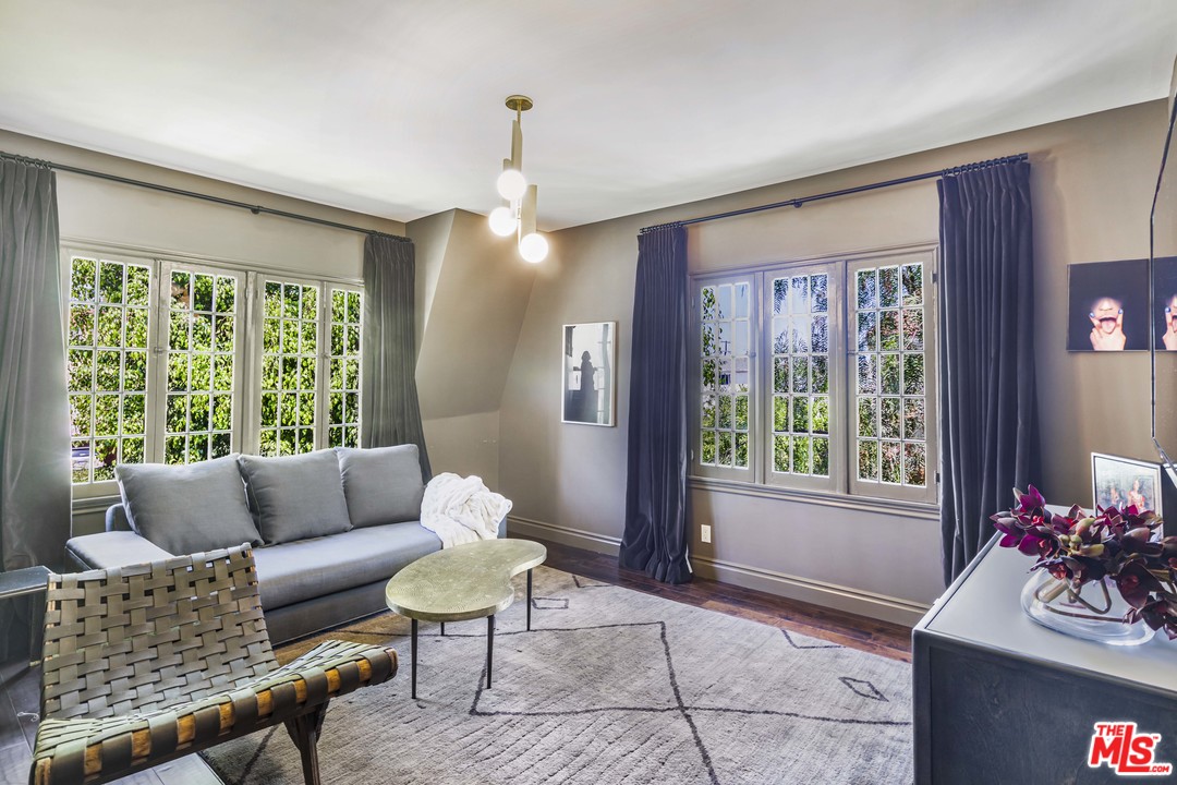 1908 Buckingham Road Los Angeles, CA 90016 - Photo 12 of 39 a living room with furniture and a large window