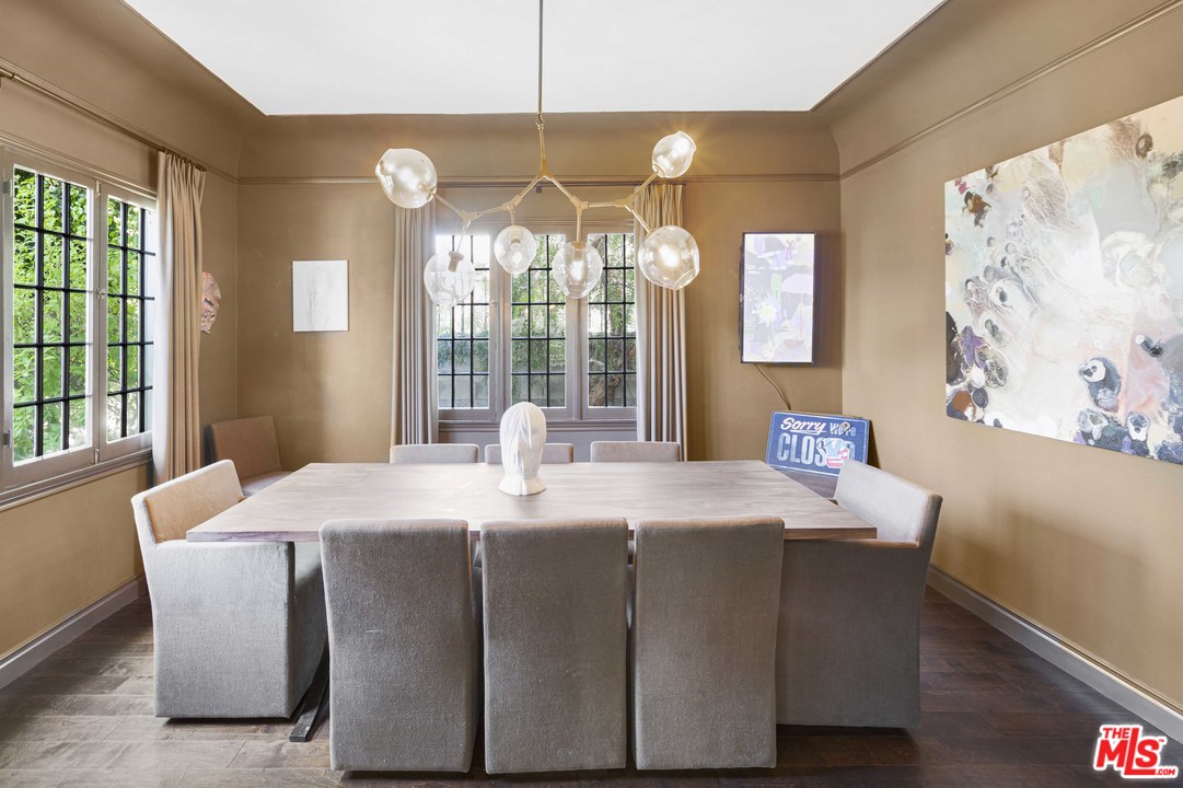 1908 Buckingham Road Los Angeles, CA 90016 - Photo 15 of 39 a dining room with a window and chandelier