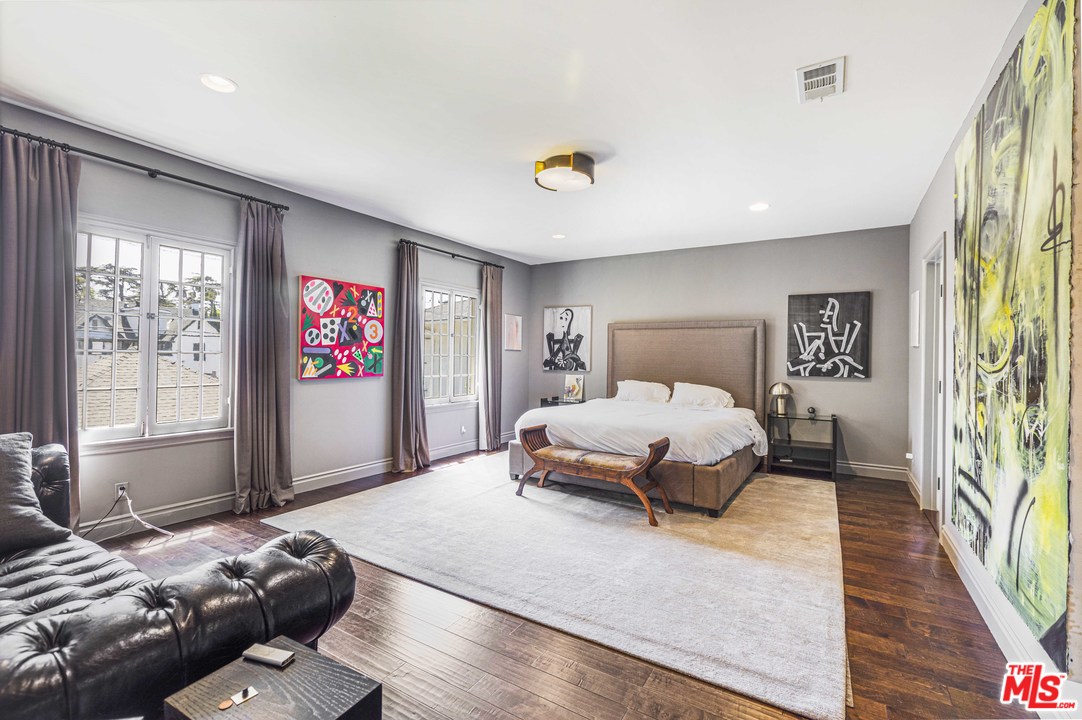 1908 Buckingham Road Los Angeles, CA 90016 - Photo 20 of 39 a bedroom with a large bed and a large window