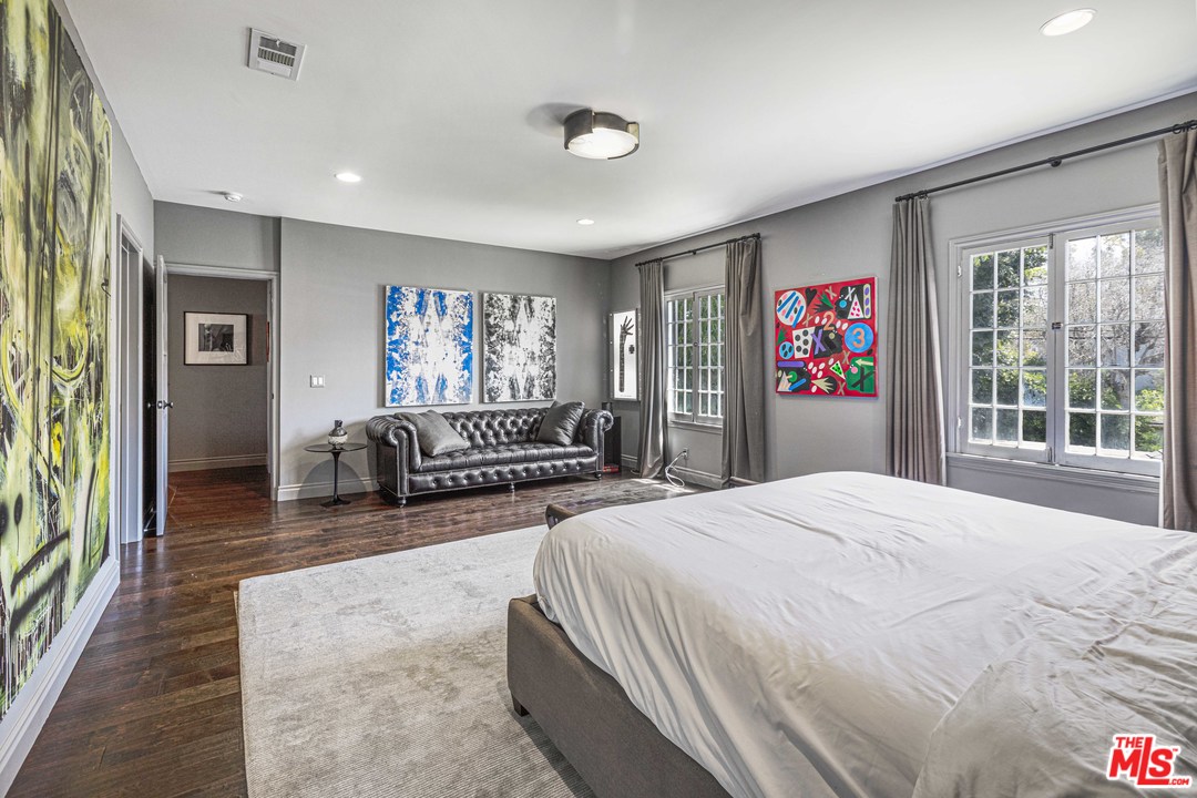 1908 Buckingham Road Los Angeles, CA 90016 - Photo 21 of 39 a spacious bedroom with a large bed and a large window