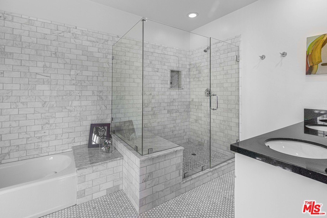 1908 Buckingham Road Los Angeles, CA 90016 - Photo 23 of 39 a bathroom with a sink a toilet and shower