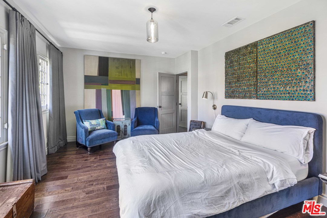 1908 Buckingham Road Los Angeles, CA 90016 - Photo 27 of 39 a bedroom with a bed a couch and a window