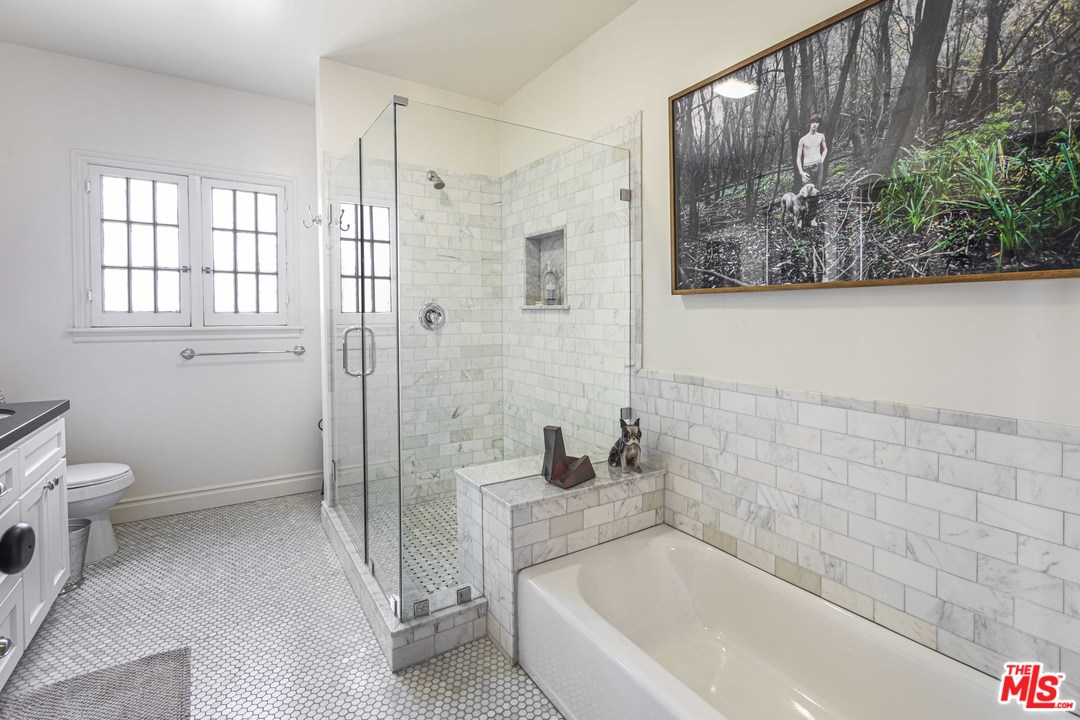 1908 Buckingham Road Los Angeles, CA 90016 - Photo 32 of 39 a bathroom with a bathtub and a shower