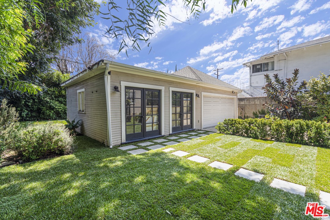 1908 Buckingham Road Los Angeles, CA 90016 - Photo 37 of 39 a view of a house with a yard and plants
