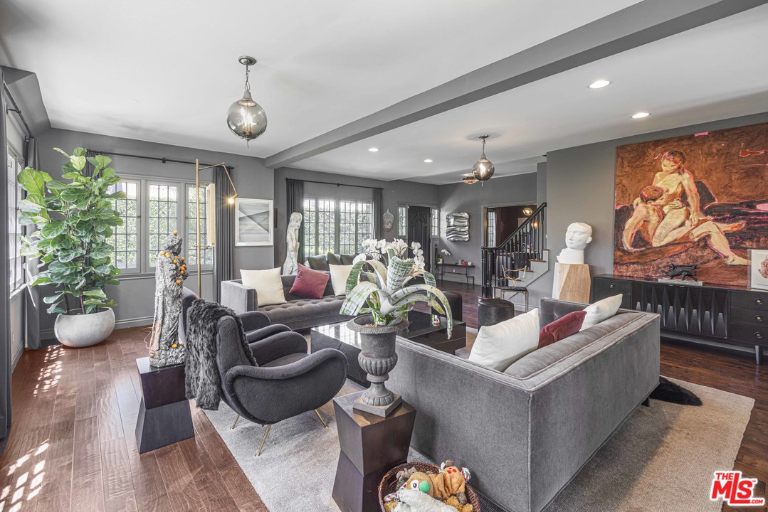 1908 Buckingham Road Los Angeles, CA 90016 - Photo 9 of 39 a living room with furniture and a large window