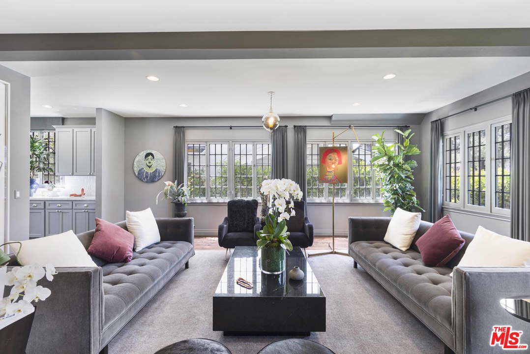 1908 Buckingham Road Los Angeles, CA 90016 - Photo 10 of 39 a living room with furniture and a large window