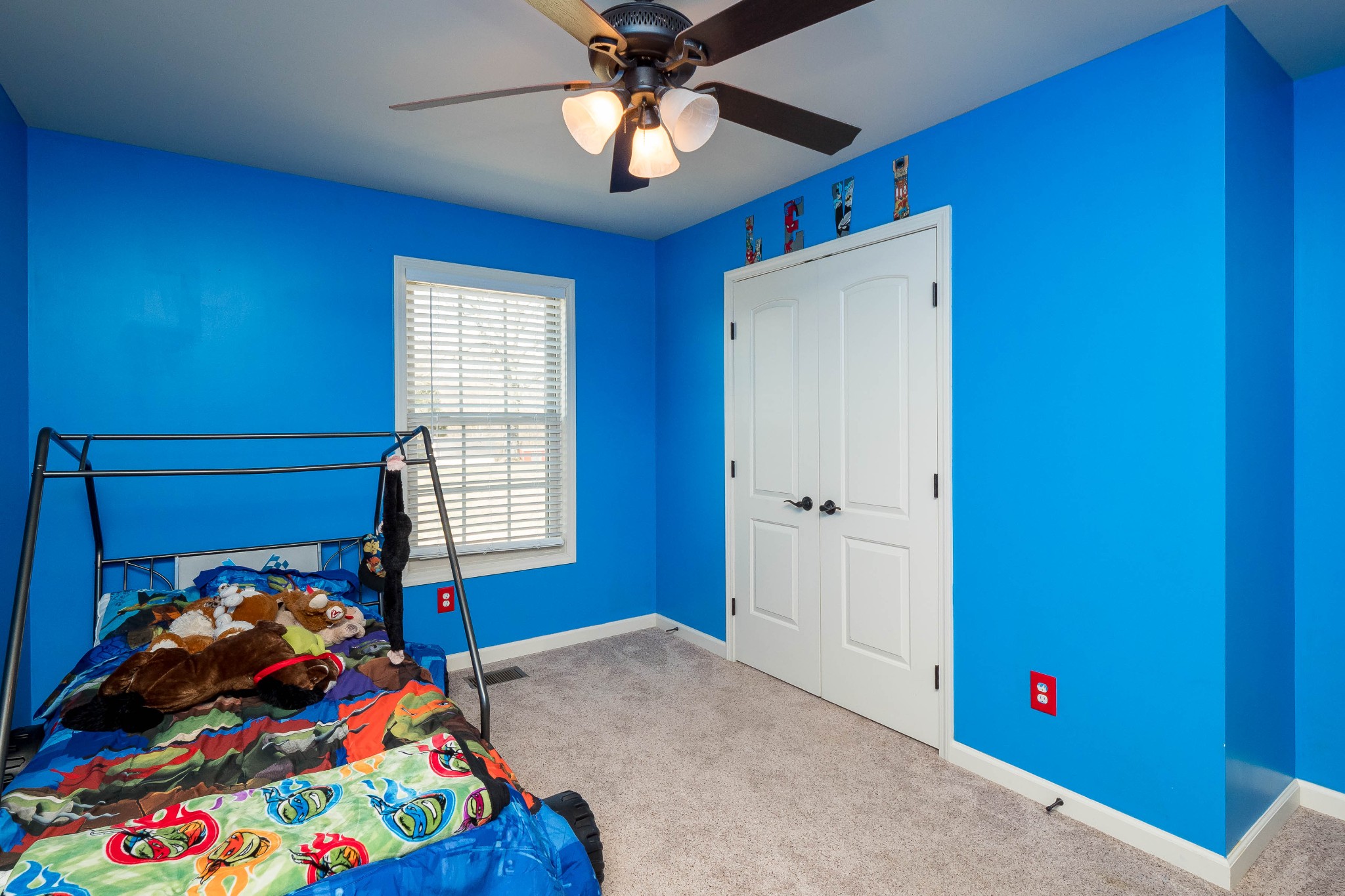 736 Lear Road Portland, TN 37148 - Photo 14 of 21 a bedroom with a bed and a chandelier