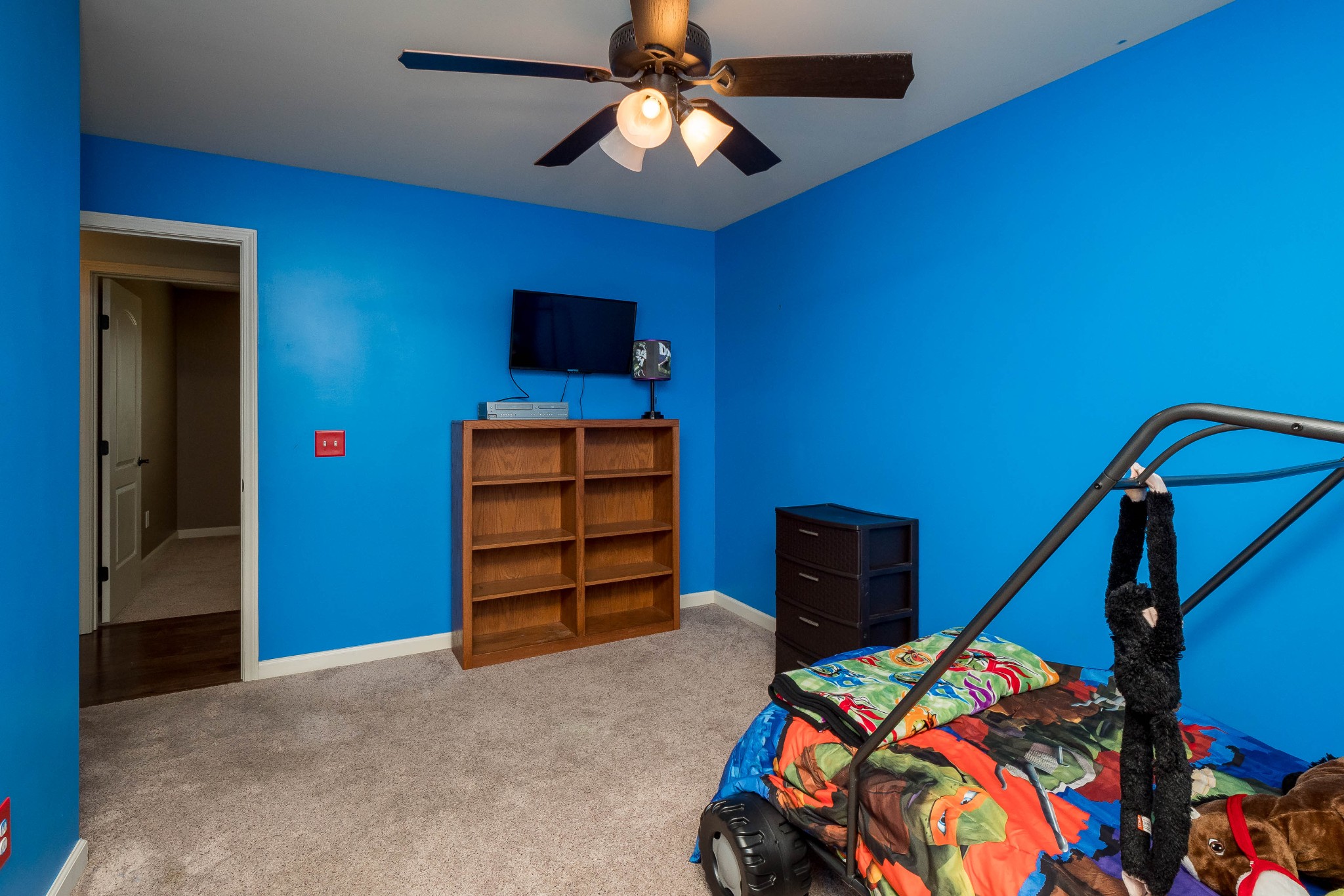 736 Lear Road Portland, TN 37148 - Photo 15 of 21 a bedroom with a bed and a chandelier
