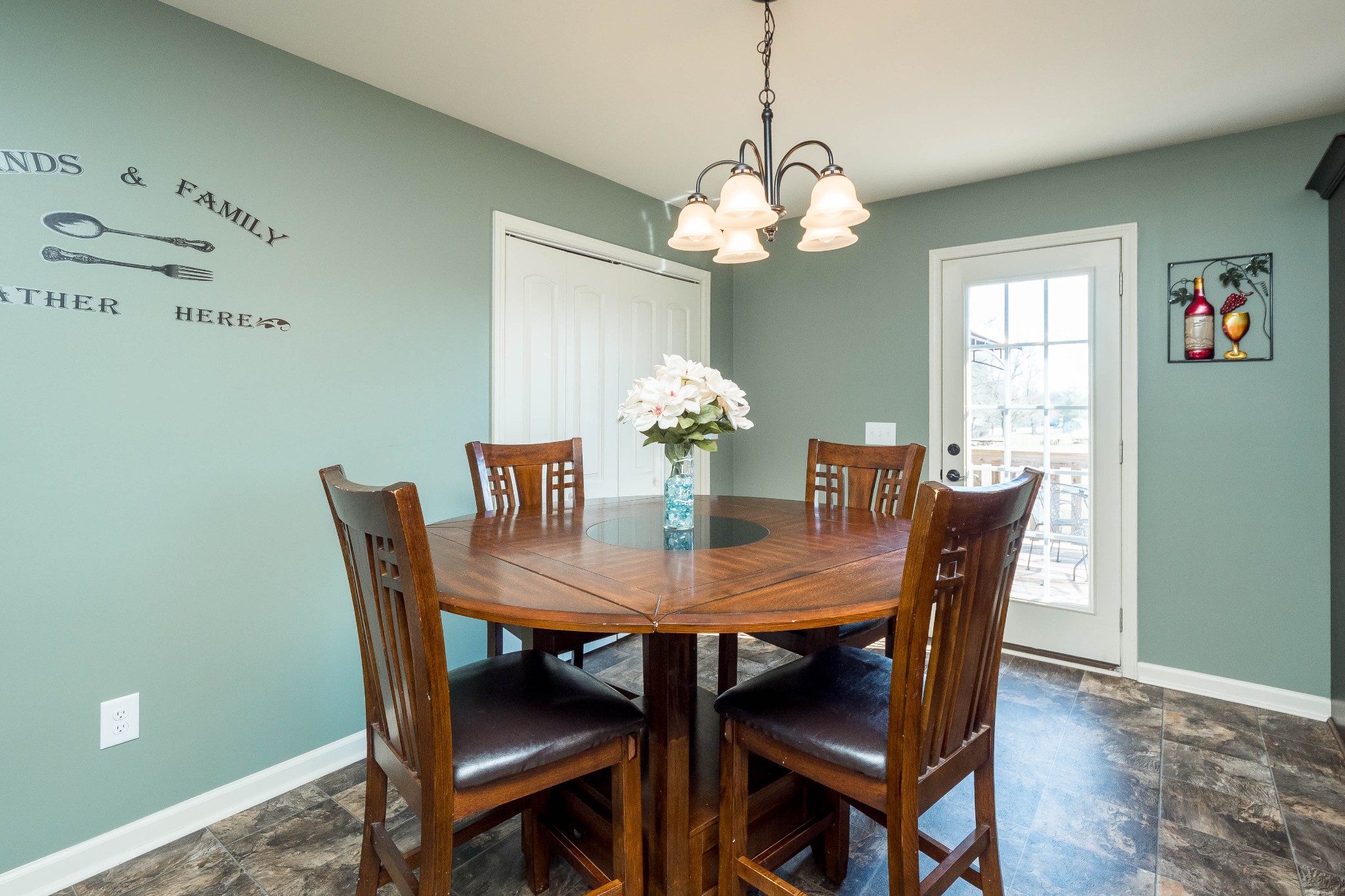 736 Lear Road Portland, TN 37148 - Photo 6 of 21 a view of a dining room with furniture a chandelier and wooden floor