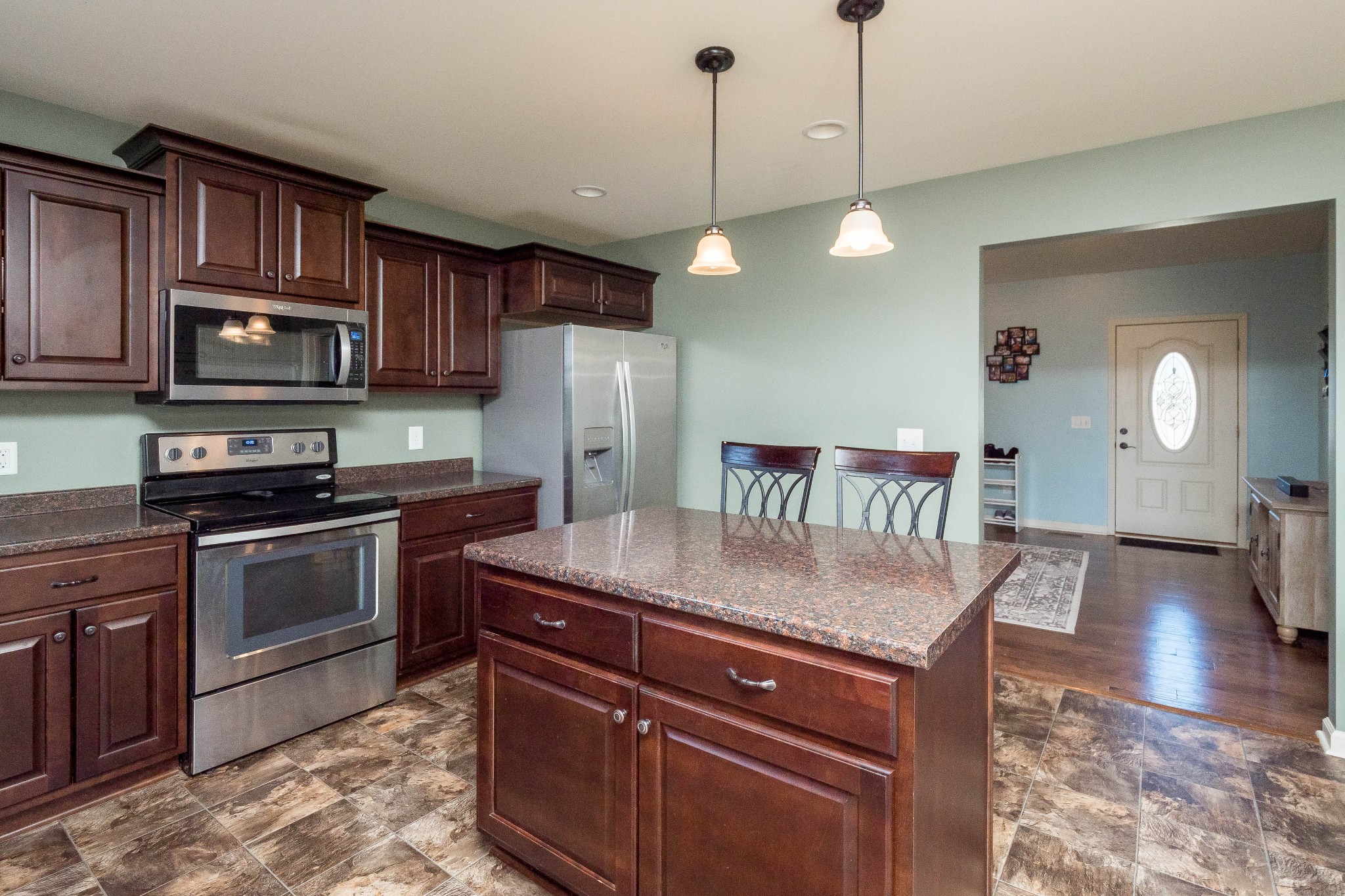 736 Lear Road Portland, TN 37148 - Photo 7 of 21 a kitchen with stainless steel appliances granite countertop a sink refrigerator and microwave