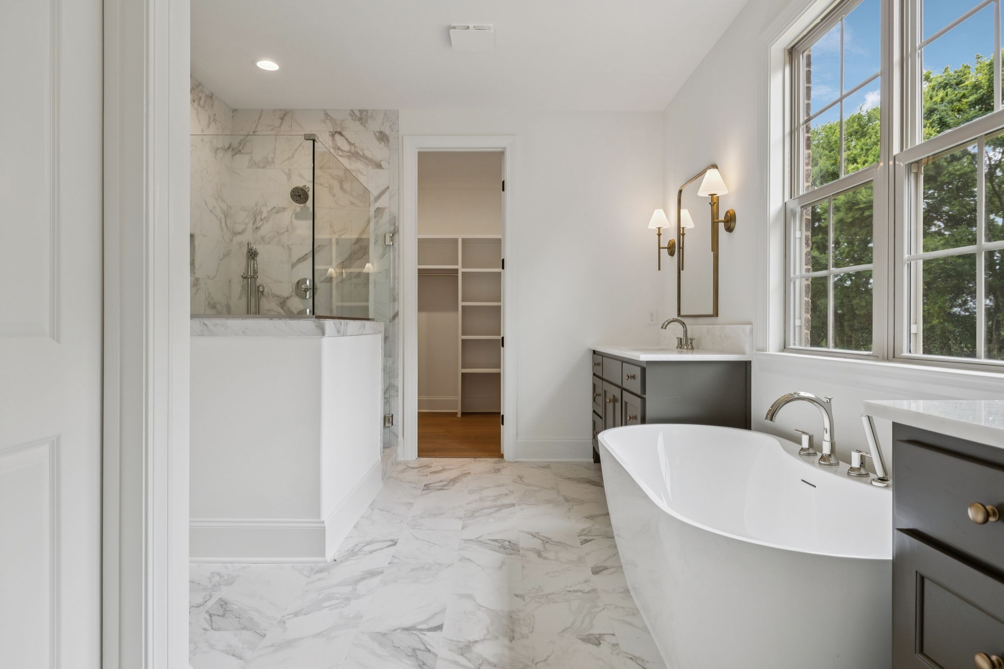 a view of a bathroom with a tub and shower