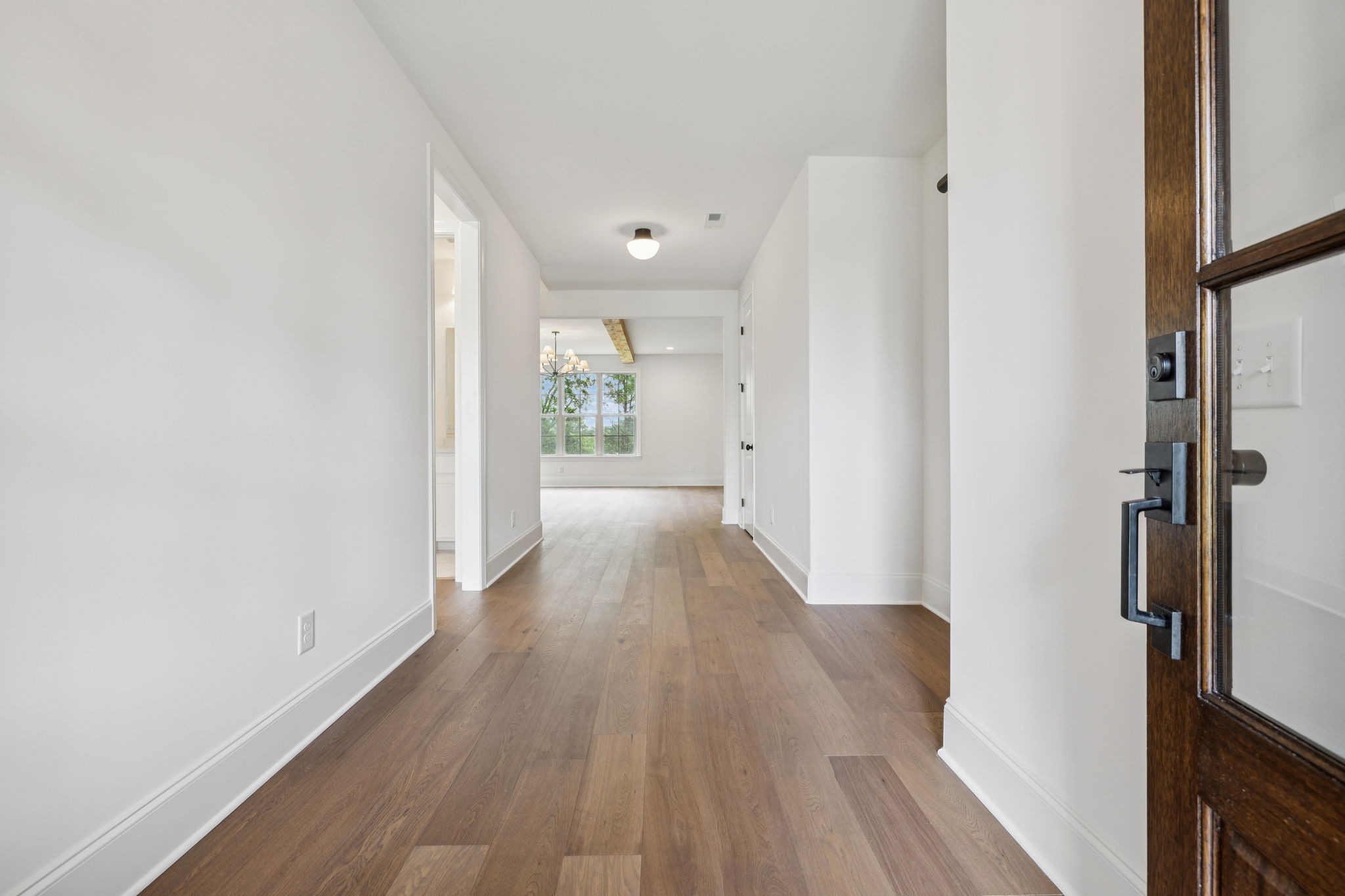 217 Bellsford Road Gallatin, TN 37066 - Photo 11 of 73 a view of a hallway with wooden floor and staircase