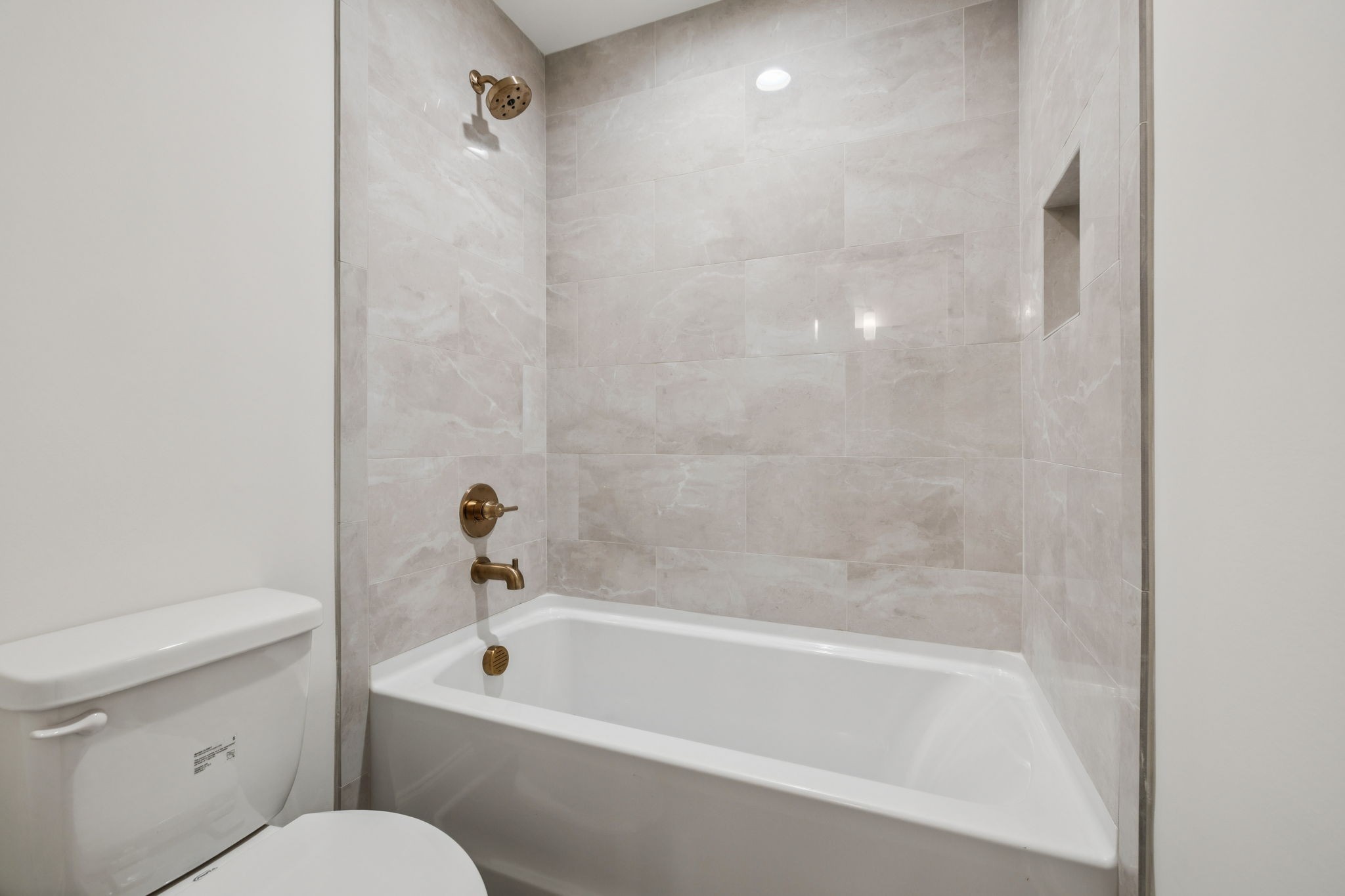 217 Bellsford Road Gallatin, TN 37066 - Photo 49 of 73 a white bath tub sitting next to a white toilet and sink