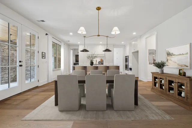 a white bath tub sitting next to a white toilet and sink