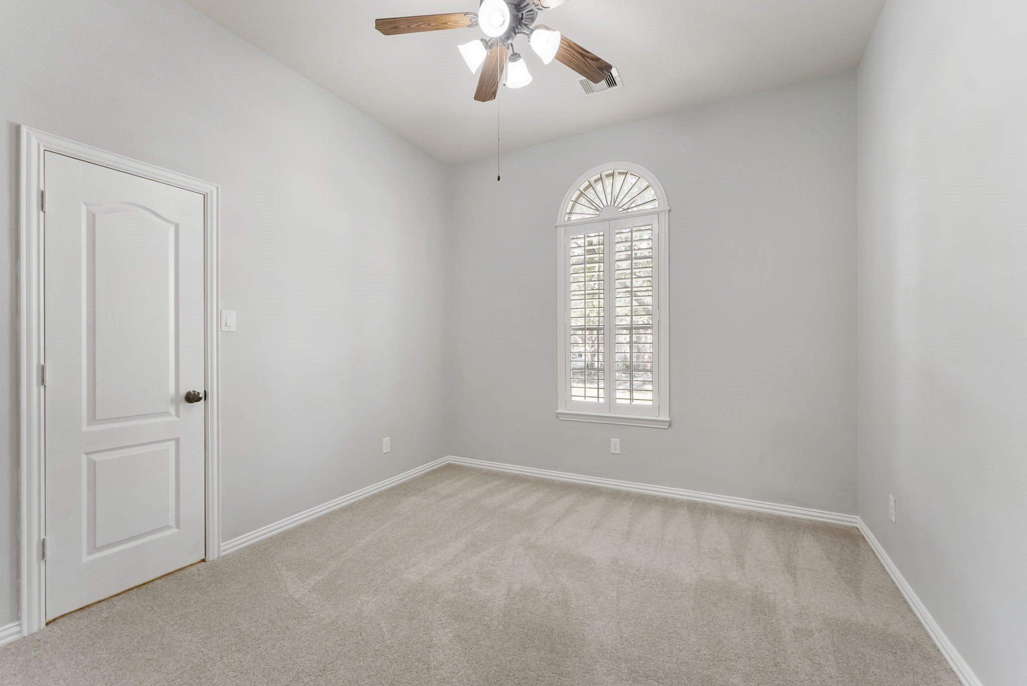 27515 Chris Ridge Court Spring, TX 77386 - Photo 18 of 31 The two downstairs secondary bedrooms are to the left as you enter the front of the house. New carpet, ceiling fan, large closet, and neutral paint.