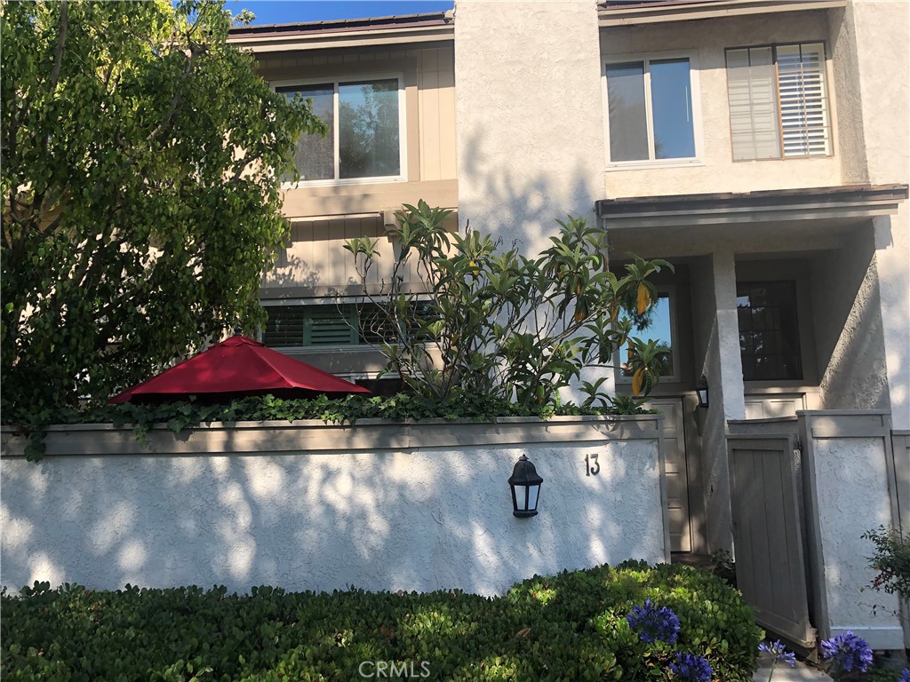 13 Starfall, Unit 7 Irvine, CA 92603 - Photo 1 of 1 an outdoor view of building with yard