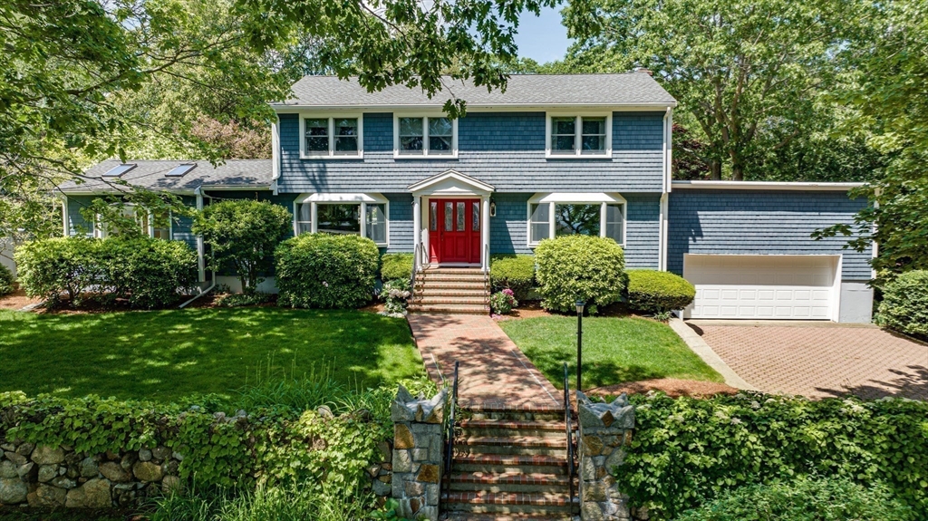 24 Flume Road Gloucester, MA 01930 - Photo 1 of 40 a front view of a house with a yard and garage