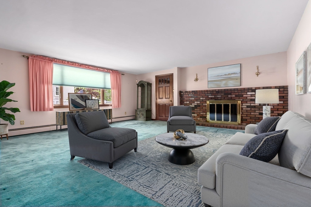 24 Flume Road Gloucester, MA 01930 - Photo 11 of 40 a living room with furniture and a fireplace