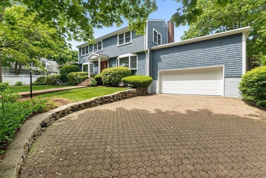 24 Flume Road Gloucester, MA 01930 - Photo 2 of 40 a front view of a house with a yard and garage