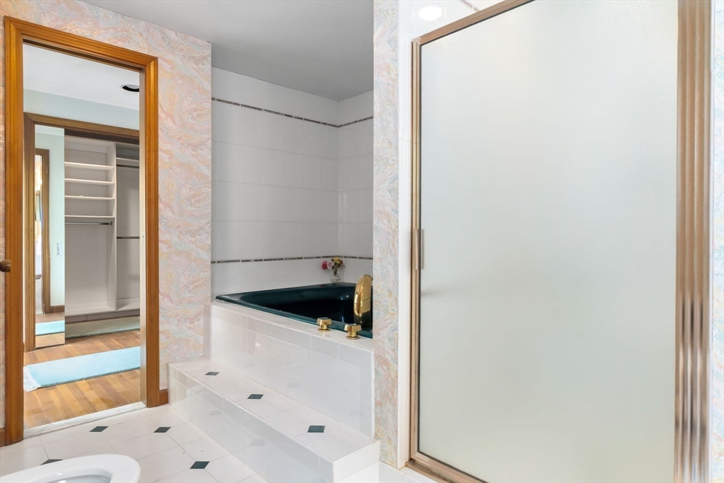 24 Flume Road Gloucester, MA 01930 - Photo 25 of 40 a bathroom with a tub and shower