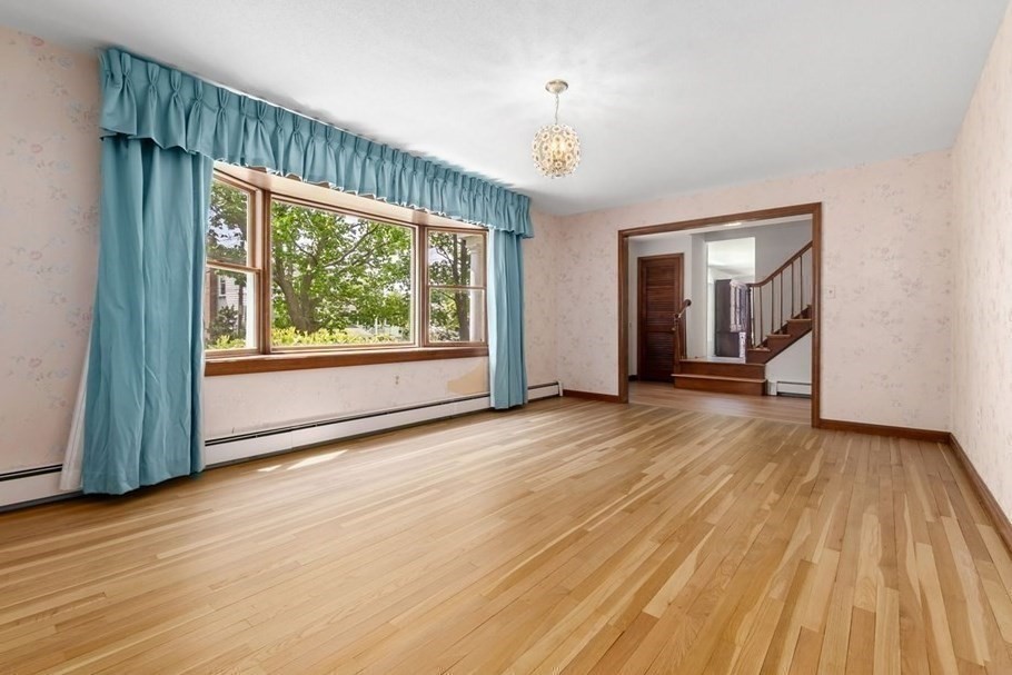 24 Flume Road Gloucester, MA 01930 - Photo 9 of 40 a view of an empty room with wooden floor and a window