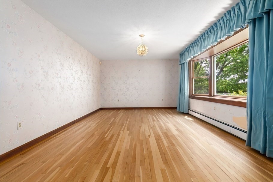 24 Flume Road Gloucester, MA 01930 - Photo 10 of 40 a view of empty room with wooden floor and fan